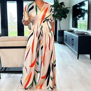 Chic Orange and White Abstract Print Jumpsuit with Wide-Leg Design